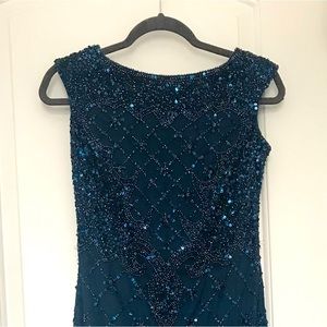 Dress for wedding or cocktail. From Adrianna Papell, the color is navy blue .